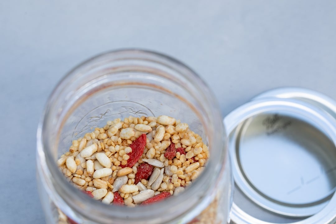 Cereal with goji berries + seeds in mason jar
