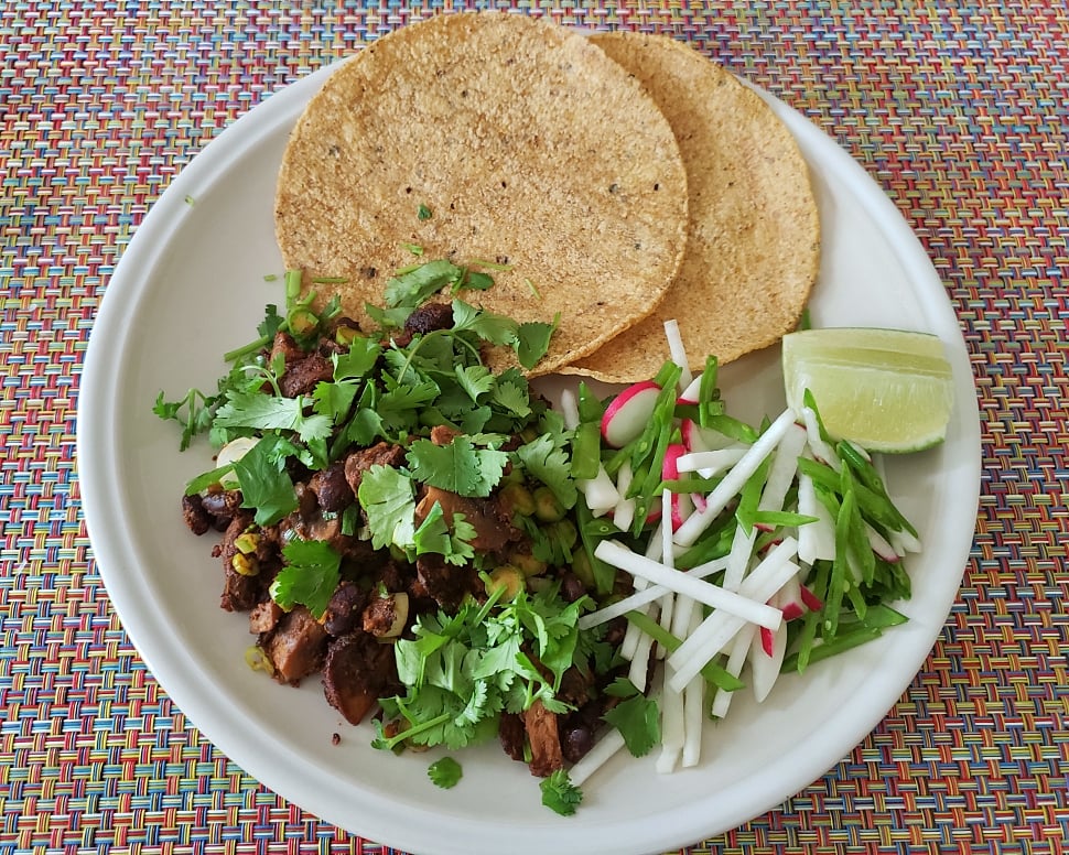 Mushroom Black Beans + herbs + slaw + 2 tortillas + lime wedge plated