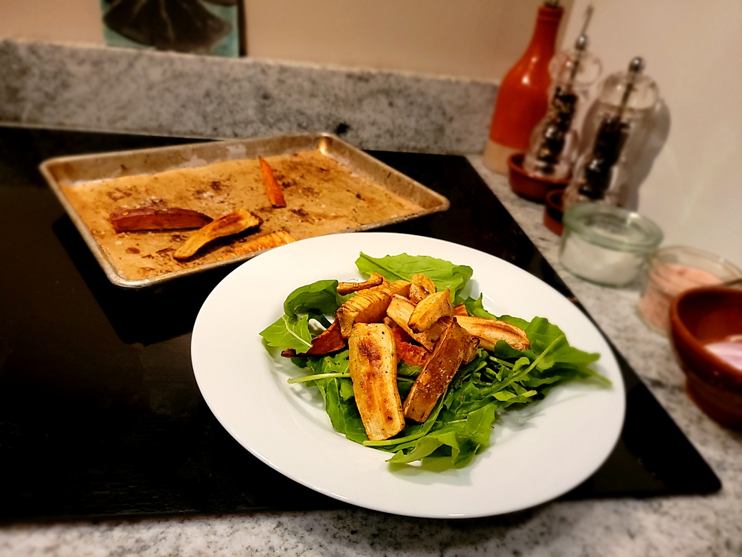 parsnip + sweet potato fries plated on salad greens + sheet pan of roasted fries